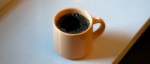 Black Coffee in Orange Mug